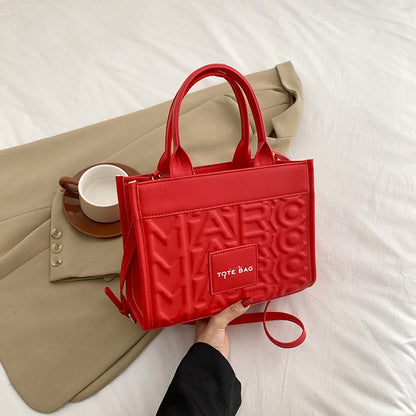 Embossed Letter Tote Bag