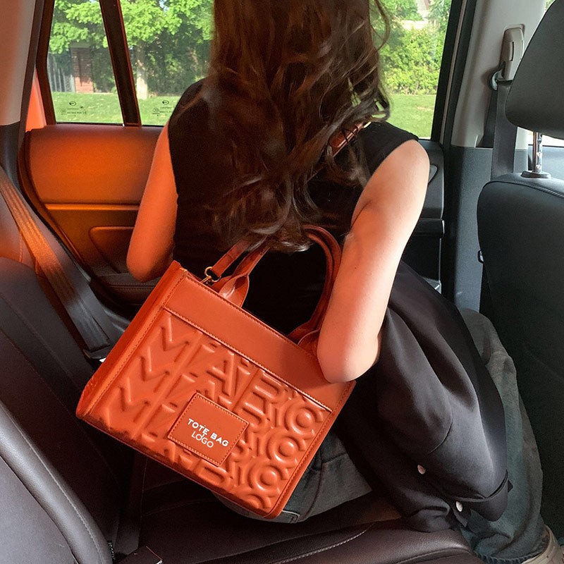 Embossed Letter Tote Bag